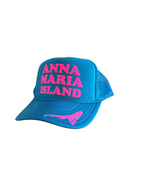 Blue trucker hat with pink letters spelling Anna Maria Island and an outline of the island on the bill by Gnarly Mangrove Designs.