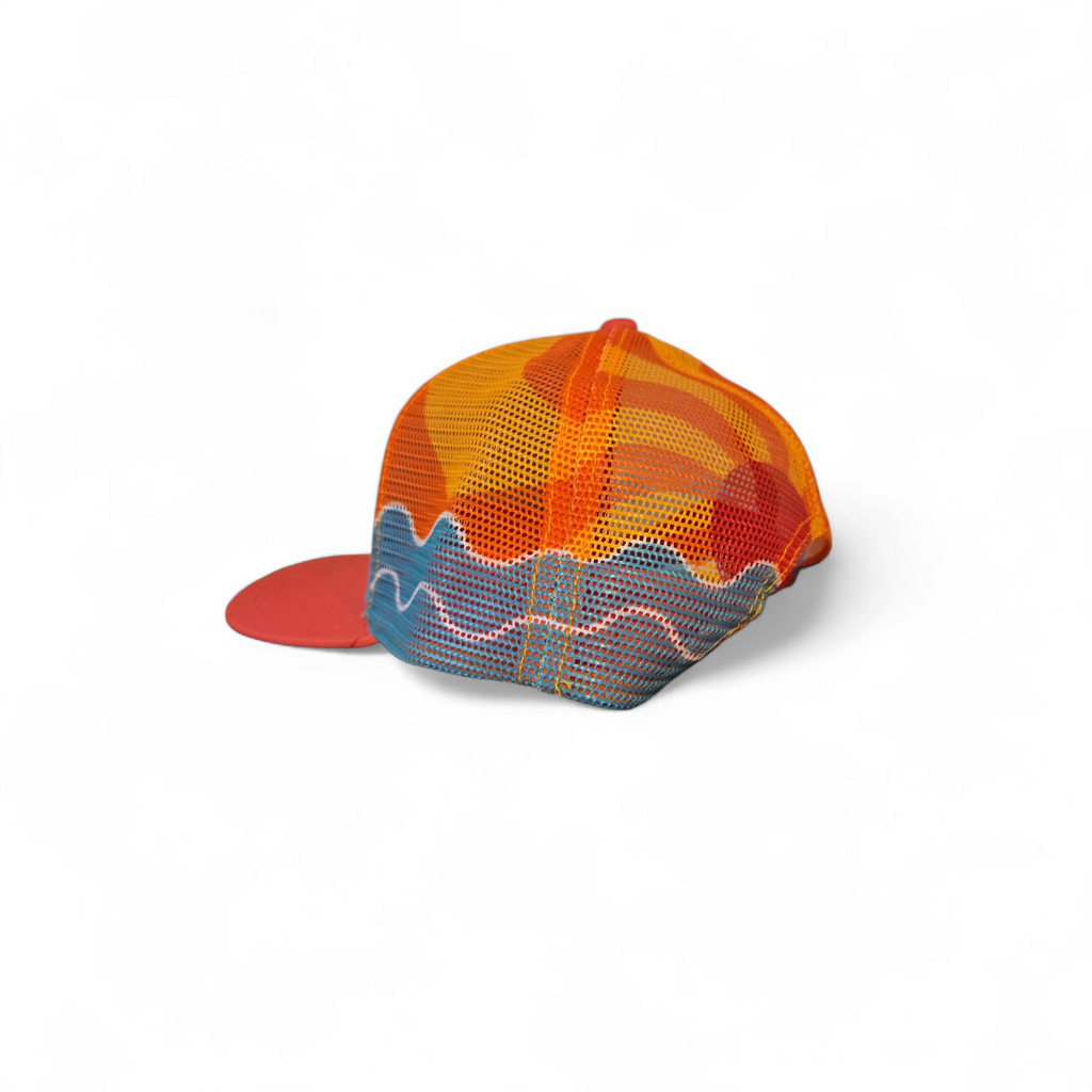 Colorful structured hat with a sunset design on the back inspired by the Gulf Coast.